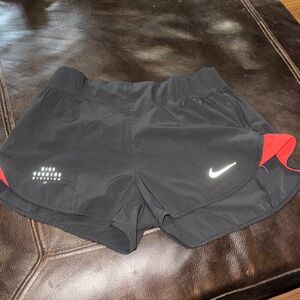 Nike Women's Black Athletic Shorts with Red Accents
